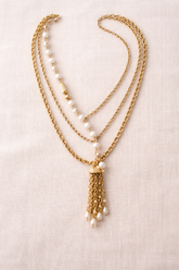 Handcrafted gold and pearl layered necklace by KStonely featuring cascading chains and tassel detail. Elegant, artistic, and truly one of a kind