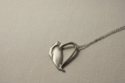 Handcrafted heart pendant made from vintage silverware. A unique, eco-friendly symbol of love—artisan-made in the USA and perfect for gifting or everyday wear.