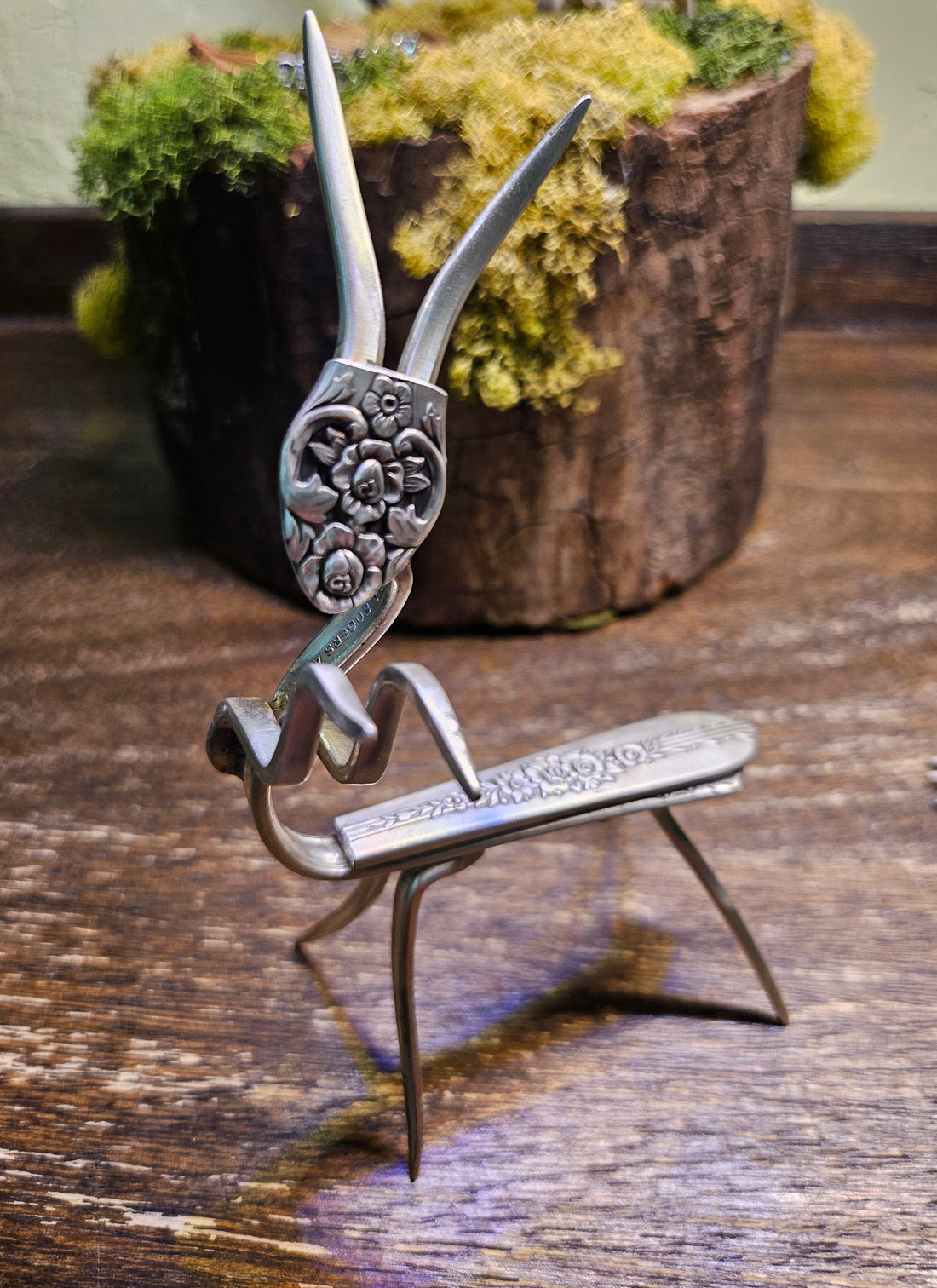 Handcrafted praying mantis sculpture made from vintage silverware. A unique, whimsical art piece symbolizing patience, intuition, and mindful beauty.