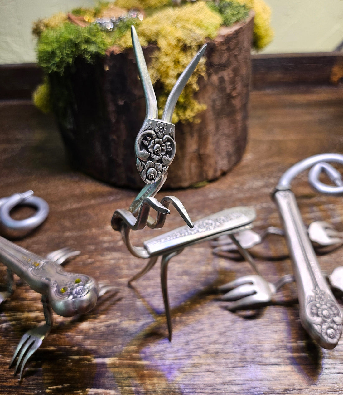 Handcrafted praying mantis sculpture made from vintage silverware. A unique, whimsical art piece symbolizing patience, intuition, and mindful beauty.