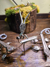 Handcrafted lizard sculpture made from vintage silverware. A whimsical, one-of-a-kind art piece symbolizing luck, renewal, and sun-loving charm.