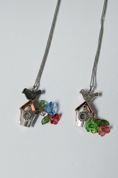 Handcrafted small birdhouse necklace made from reclaimed vintage silverware. Whimsical, cottagecore, eco-friendly jewelry perfect for nature lovers and unique gift giving.