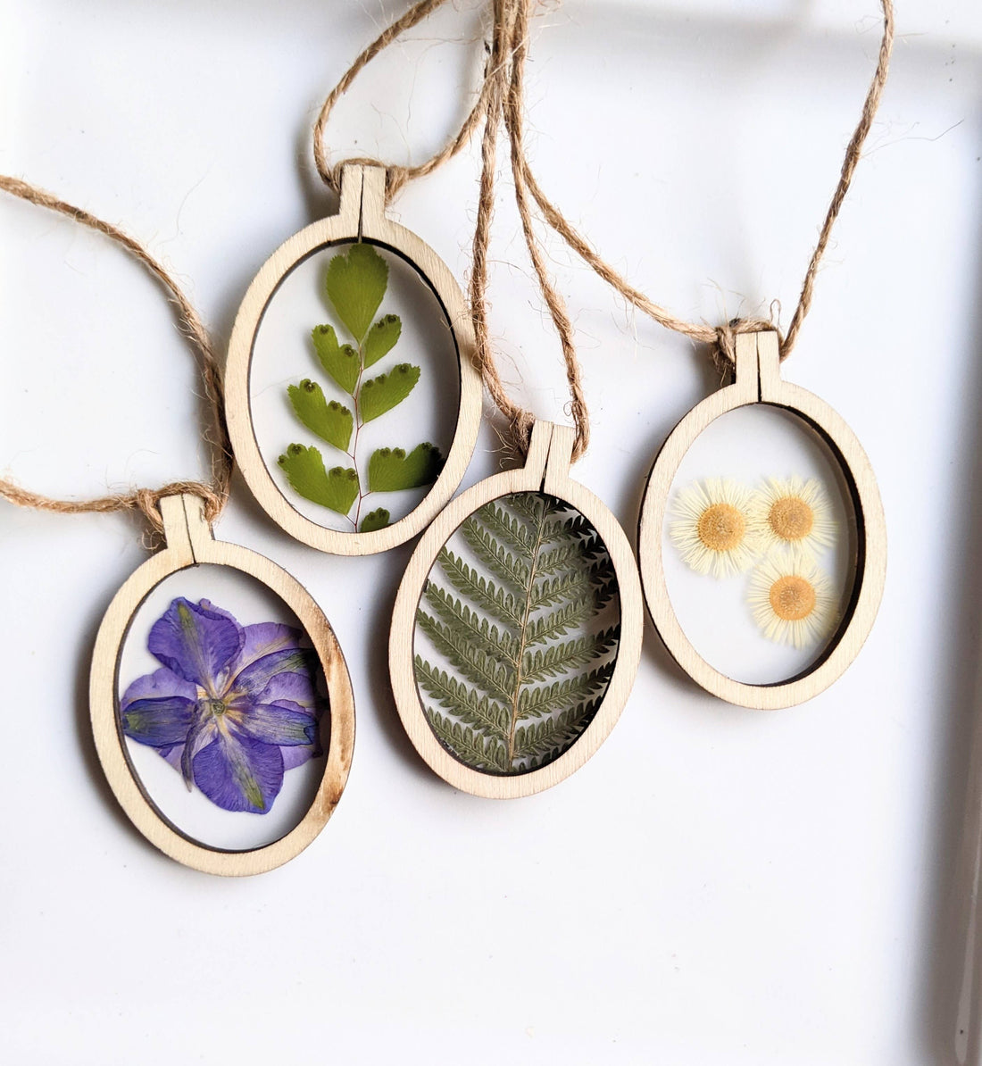 Handcrafted wood frame ornaments with real pressed flowers or leaves. Unique, nature-inspired décor perfect for holiday trees, gifts, or year-round charm.
