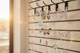 Handmade butterfly suncatchers with real pressed flowers and crystal chain. Reflects sunlight into rainbows—perfect for windows or near plants.