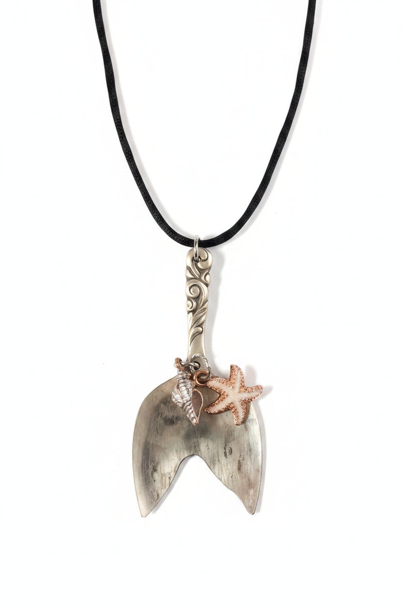 Handmade mermaid tail pendant crafted from vintage silverware. A whimsical, ocean-inspired treasure—eco-friendly, one-of-a-kind, and artisan-made in the USA.