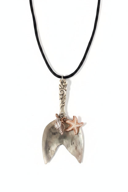 Handmade mermaid tail pendant crafted from vintage silverware. A whimsical, ocean-inspired treasure—eco-friendly, one-of-a-kind, and artisan-made in the USA.