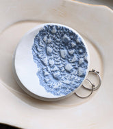 Handmade polymer clay dish with a green lace impression. Perfect as a jewelry or ring holder. Durable, decorative, and one-of-a-kind. Not food safe.