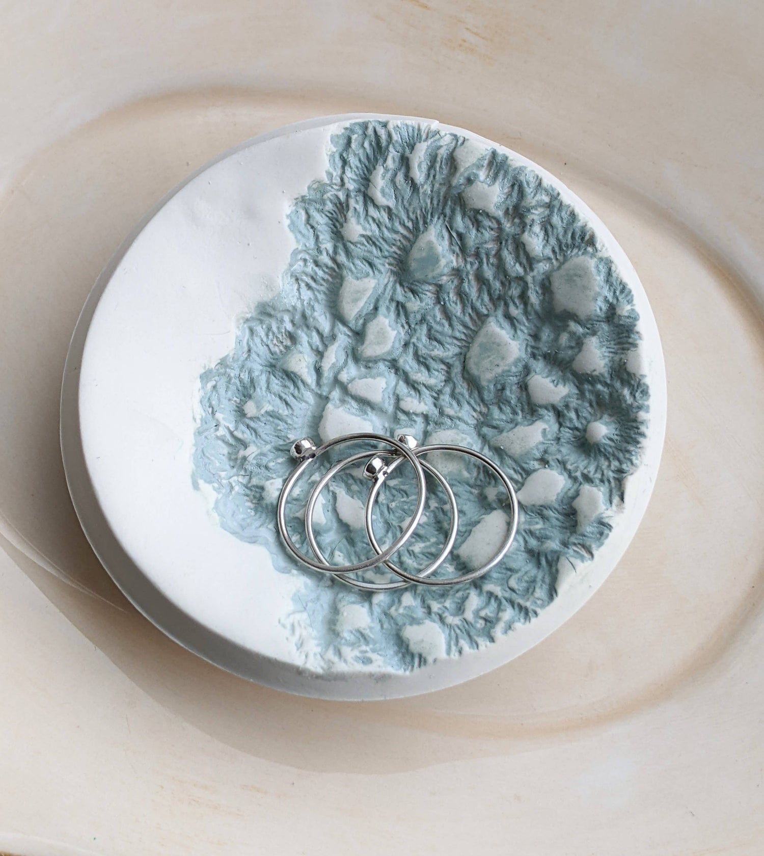 Handmade polymer clay dish with a green lace impression. Perfect as a jewelry or ring holder. Durable, decorative, and one-of-a-kind. Not food safe.
