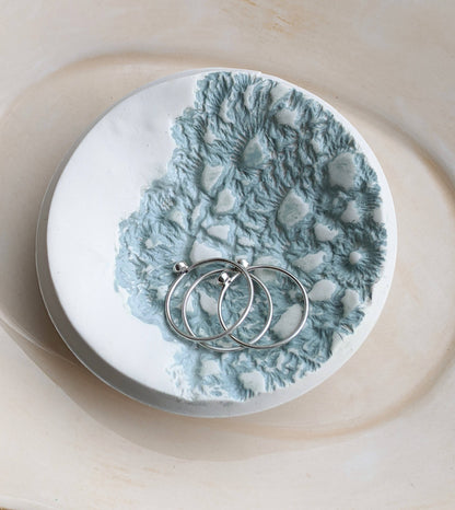 Handmade polymer clay dish with a green lace impression. Perfect as a jewelry or ring holder. Durable, decorative, and one-of-a-kind. Not food safe.