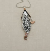 Handcrafted silver birdhouse pendant made from vintage silverware. A whimsical, one-of-a-kind necklace perfect for nature lovers and vintage jewelry fans.