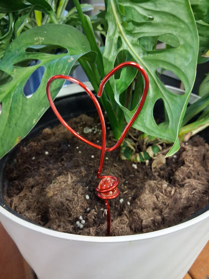 Decorative mini wire and marble plant stakes bring artistic charm to houseplants, terrariums, and plant shelves. Handcrafted botanical accents.