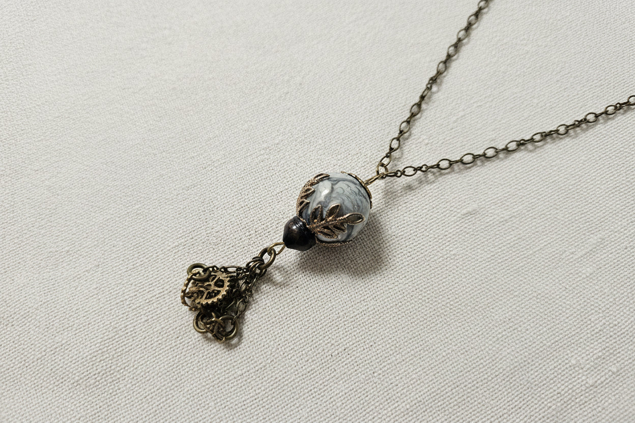 Steampunk pendants with gears, chains, tags, beads, and airship-inspired designs. Handcrafted, unique mixed-media necklaces perfect for cosplay, gifting, and fans of steampunk