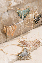 Shimmering beaded tassel chandelier earrings with a lightweight metal ring, hypoallergenic fish hooks, and dazzling glass beads—perfect for any occasion! 