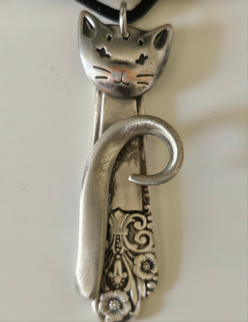 Handmade silver sassy cat pendant necklaces from vintage silverware. Elegant, whimsical, and adjustable on a satin cord. Sustainably crafted and one-of-a-kind.