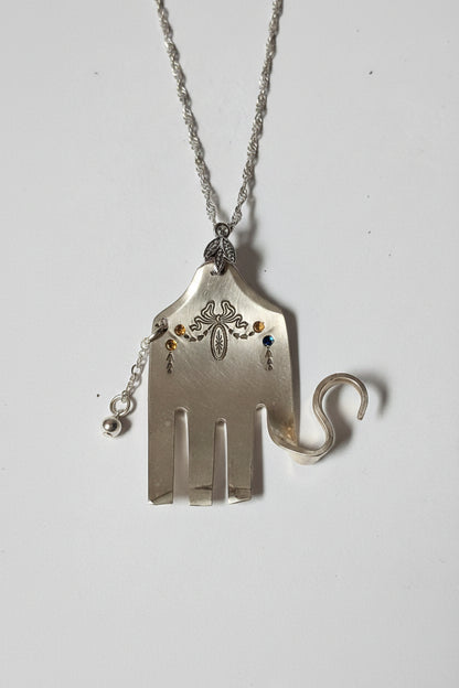 Handcrafted silver elephant pendant made from vintage silverware. Symbolizes strength, wisdom &amp; luck. Eco-friendly, one-of-a-kind, and artisan-made in the USA. Mmade from vintage silverware. Symbolizes strength, wisdom &amp; luck. Eco-friendly, one-of-a-kind, and artisan-made in the USA.