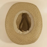Cowrie Shell Band Cowboy Hat featuring woven paper straw texture and coastal boho western style. Lightweight, breathable, and perfect for beach days or festivals.