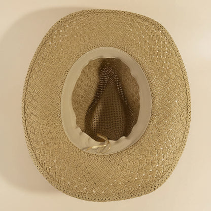 Cowrie Shell Band Cowboy Hat featuring woven paper straw texture and coastal boho western style. Lightweight, breathable, and perfect for beach days or festivals.