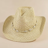 Cowrie Shell Band Cowboy Hat featuring woven paper straw texture and coastal boho western style. Lightweight, breathable, and perfect for beach days or festivals.