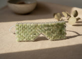 Cooling or warming jade eye mask made from 100% real jade beads. Reduces puffiness, soothes tension, boosts circulation, and brings calm, balance, and radiant renewal.