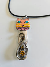 Handcrafted vintage silverware necklaces featuring enamel cat faces on adjustable satin cords. Made from 1951 Distinction and 1952 Primrose patterns.