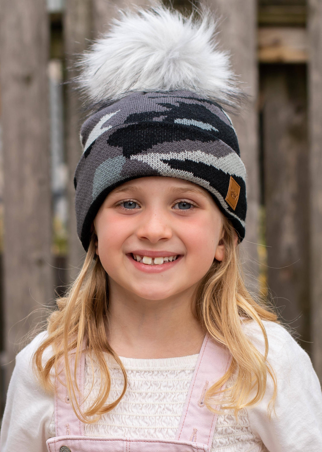 Kids grey camo knit hat with faux fur pom—cozy, durable, and playful. Perfect for autumn &amp; winter adventures, keeping little ones warm in style.
