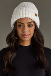 White chunky knit cuffed beanie with cozy fleece lining. Made from 100% acrylic, this classic winter hat adds warmth and timeless style to chilly days.