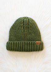 Olive chunky knit cuffed beanie with cozy fleece lining. Made from 100% acrylic, this classic winter hat adds warmth and earthy style to chilly days.