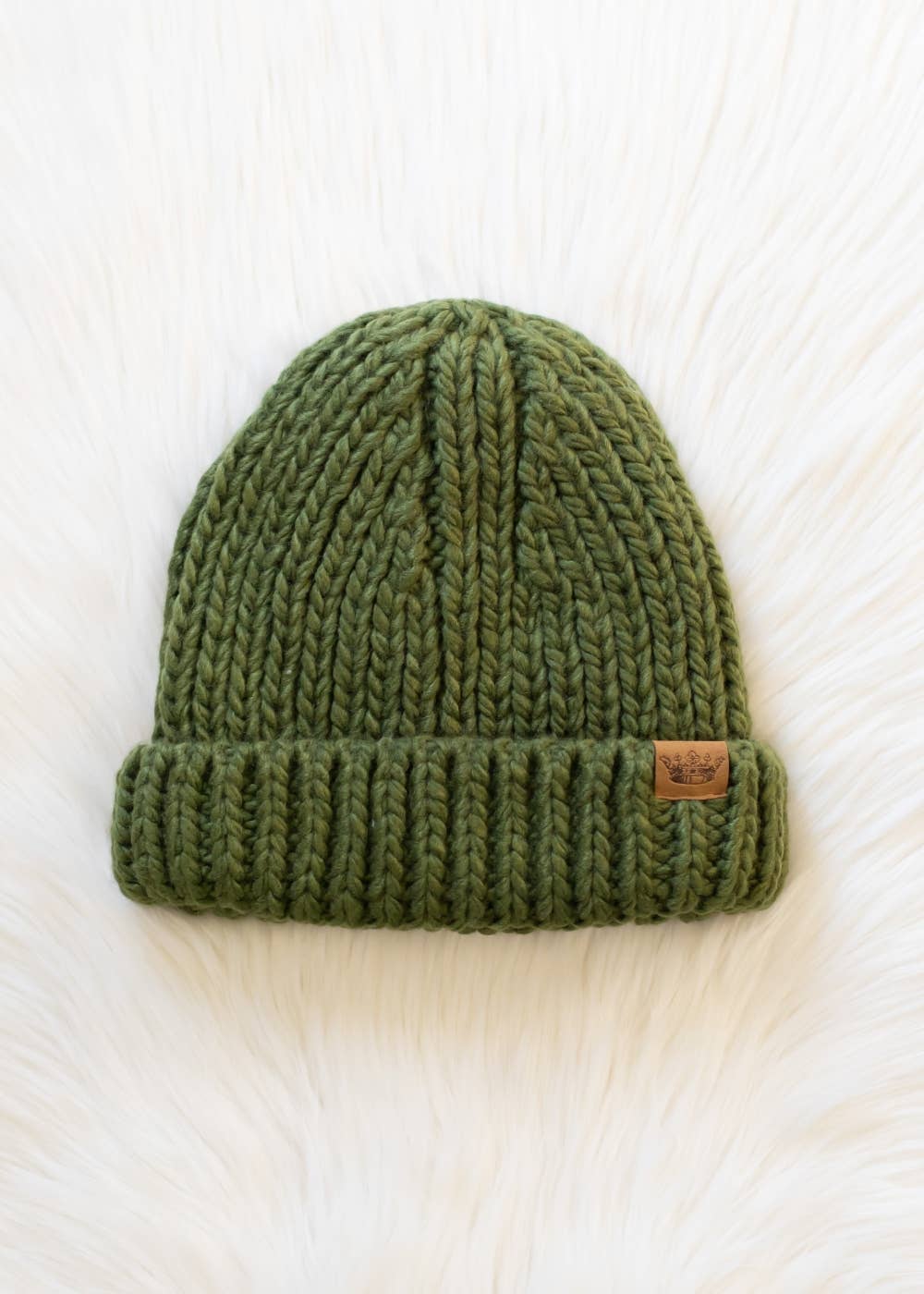 Olive chunky knit cuffed beanie with cozy fleece lining. Made from 100% acrylic, this classic winter hat adds warmth and earthy style to chilly days.