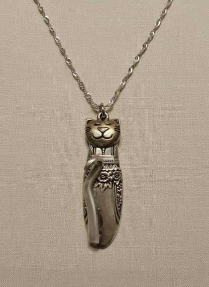 Handmade silver cat pendant necklaces from vintage silverware. Elegant, whimsical, and adjustable on a satin cord. Sustainably crafted and one-of-a-kind.
