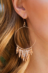 Shimmering beaded tassel chandelier earrings with a lightweight metal ring, hypoallergenic fish hooks, and dazzling glass beads—perfect for any occasion! 
