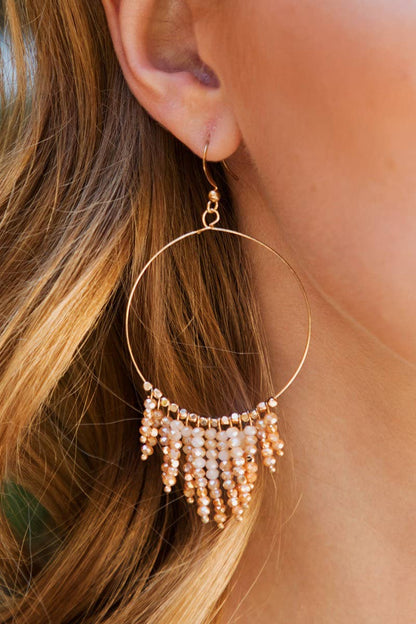 Shimmering beaded tassel chandelier earrings with a lightweight metal ring, hypoallergenic fish hooks, and dazzling glass beads—perfect for any occasion! 