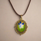 Palace Bloom Vintage Floral Necklace with real dried flowers in resin, antique-style pendant, and waxed rope chain. Lightweight, elegant, and one-of-a-kind.