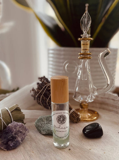 Unleash your inner goddess with Medusa Perfume Roller—jasmine, saffron, and cedarwood infused with aventurine and sea shells for oceanic allure.