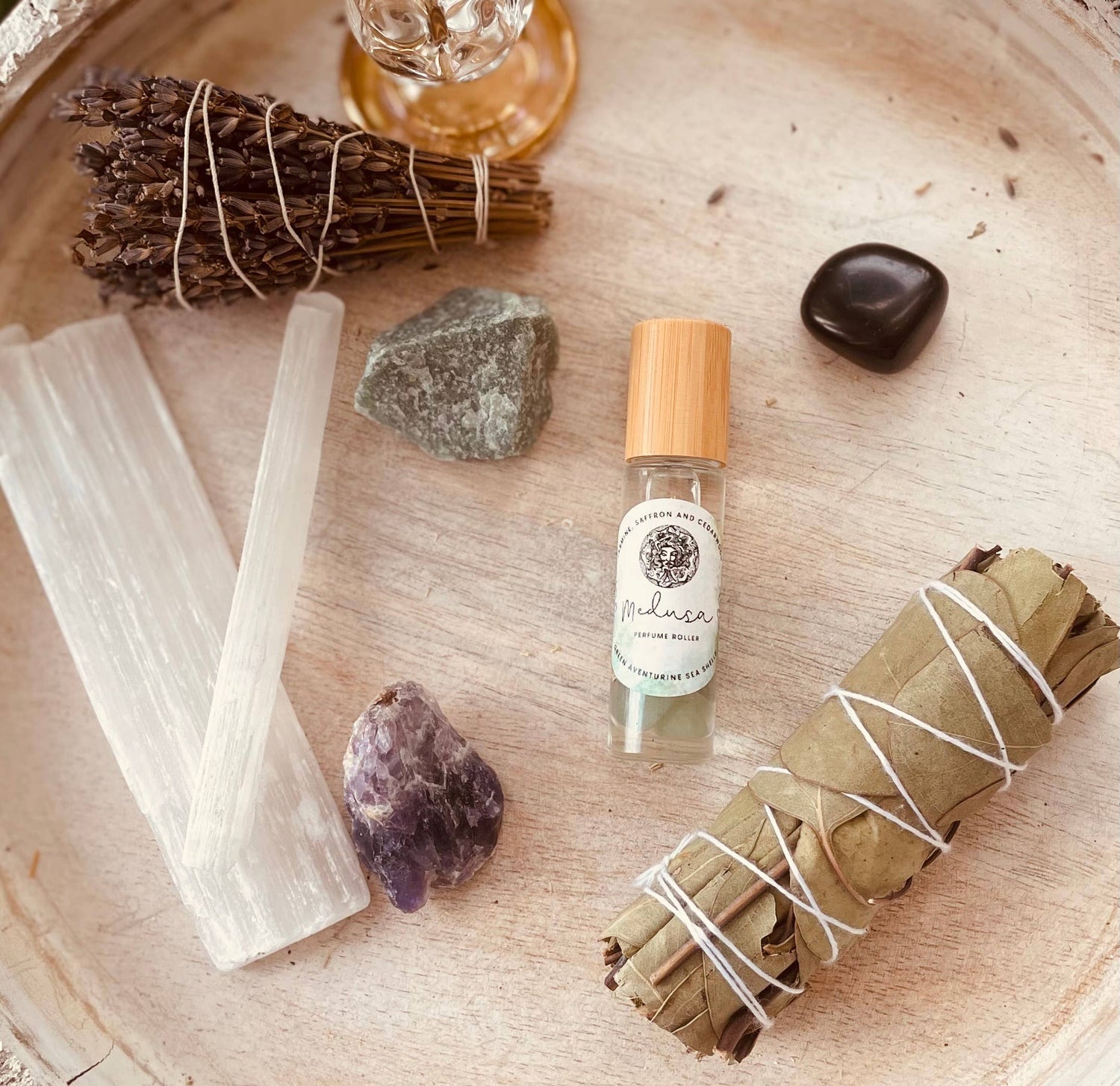 Unleash your inner goddess with Medusa Perfume Roller—jasmine, saffron, and cedarwood infused with aventurine and sea shells for oceanic allure.