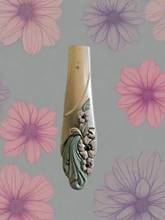 Whimsical bud vases crafted from vintage silverware with magnetic backs—perfect for single blooms and small clippings. Each one is a one-of-a-kind treasure.