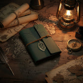 Mini Vintage Leather Journal with dark green botanical cover, metal leaf charm, refillable 6-ring binder and blank kraft pages for writing, travel or sketching.