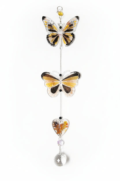 Handmade butterfly suncatchers with real pressed flowers and crystal chain. Reflects sunlight into rainbows—perfect for windows or near plants.