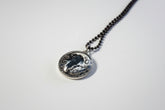 Handcrafted nature scene necklaces with real botanicals in iridescent and clear resin. Unique, wearable landscapes on chain or satin cord.