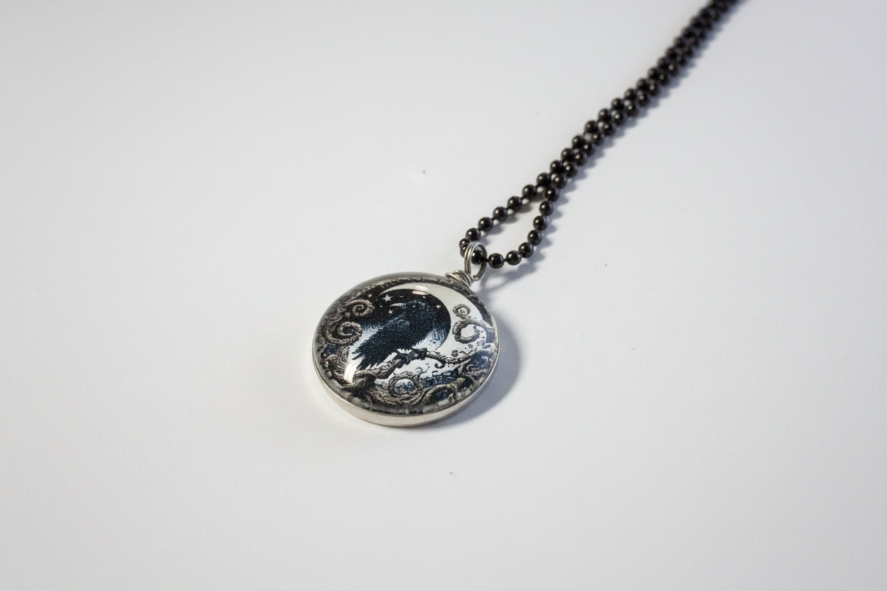 Handcrafted nature scene necklaces with real botanicals in iridescent and clear resin. Unique, wearable landscapes on chain or satin cord.