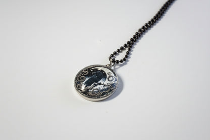 Handcrafted nature scene necklaces with real botanicals in iridescent and clear resin. Unique, wearable landscapes on chain or satin cord.