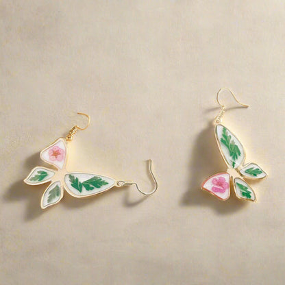 Narcissus &amp; Ferns Butterfly Earrings with real pressed flowers in resin and gold-tone metal. Lightweight, nature-inspired statement jewelry for any occasion.