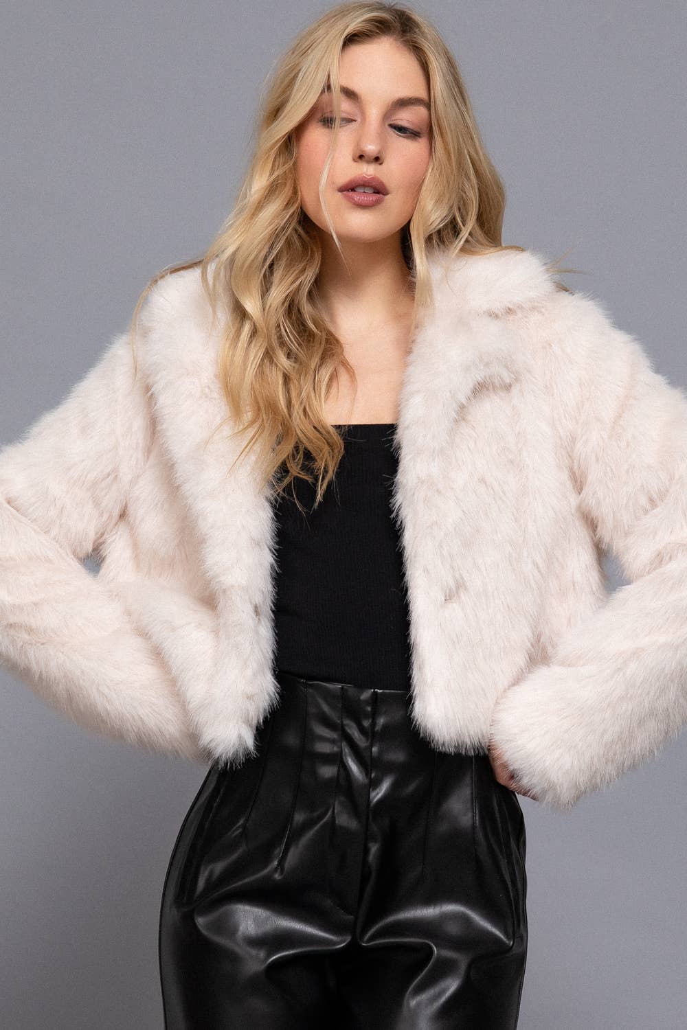 Notched Collar Faux Fur Crop Jacket with plush texture, single-button closure and chic cropped fit. A cozy, stylish layer for casual or evening looks.
