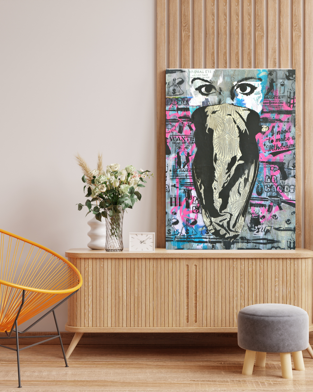 Notorious is a bold 36&quot;x48&quot; mixed media artwork blending street art and graffiti with urban textures. Featuring a masked figure against a backdrop of vibrant pink, blue, and muted tones, it embodies rebellion and raw energy. Perfect for modern spaces, it pairs beautifully with a Monstera plant to create an edgy, balanced aesthetic.