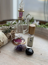 Nyx Goddess Perfume Roller with coconut oil, black obsidian & mallow flower. Oriental and almond notes create a mystical, night-inspired aura.