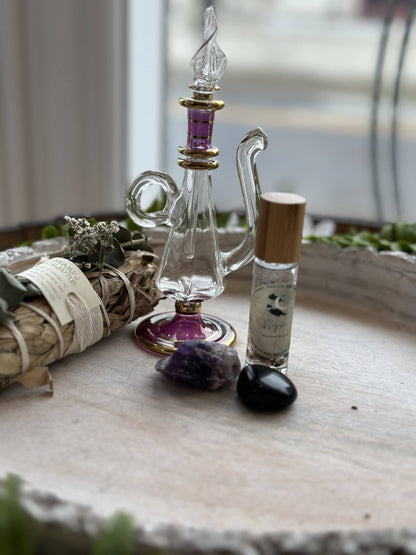 Nyx Goddess Perfume Roller with coconut oil, black obsidian &amp; mallow flower. Oriental and almond notes create a mystical, night-inspired aura.