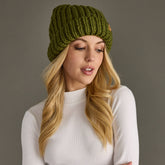 Olive chunky knit cuffed beanie with cozy fleece lining. Made from 100% acrylic, this classic winter hat adds warmth and earthy style to chilly days.