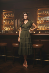 Olive tiered ruffle midi dress with a flattering V-neck, shirred empire waist and flutter sleeves. A romantic, flowing dress perfect for fall and events.