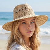Open weave wide brim straw hat featuring breathable lattice texture and lightweight paper straw design. Perfect for beach days, festivals, vacations, and summer styling.