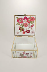 Floral mirrored keepsake and jewelry box with real pressed flowers. A 5" botanical glass box by artist Angel Singh, blending elegant storage with preserved floral art.