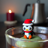 Christmas Penguin Tea Steeper with silicone cap and fine mesh. Perfect for hot or iced tea, reusable, giftable, and designed with heart.